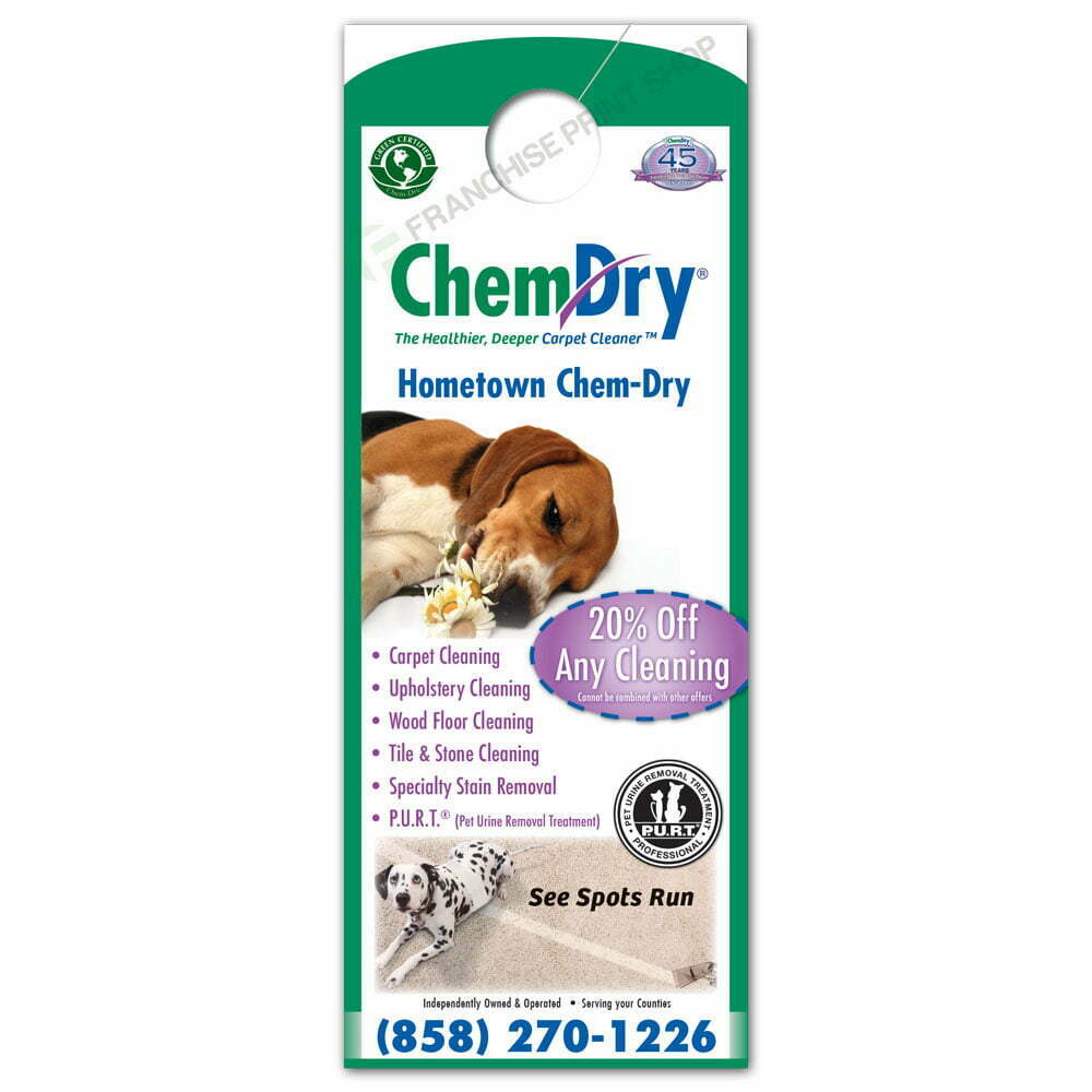 front view of a custom printed ChemDry door hanger with two dogs laying on carpet