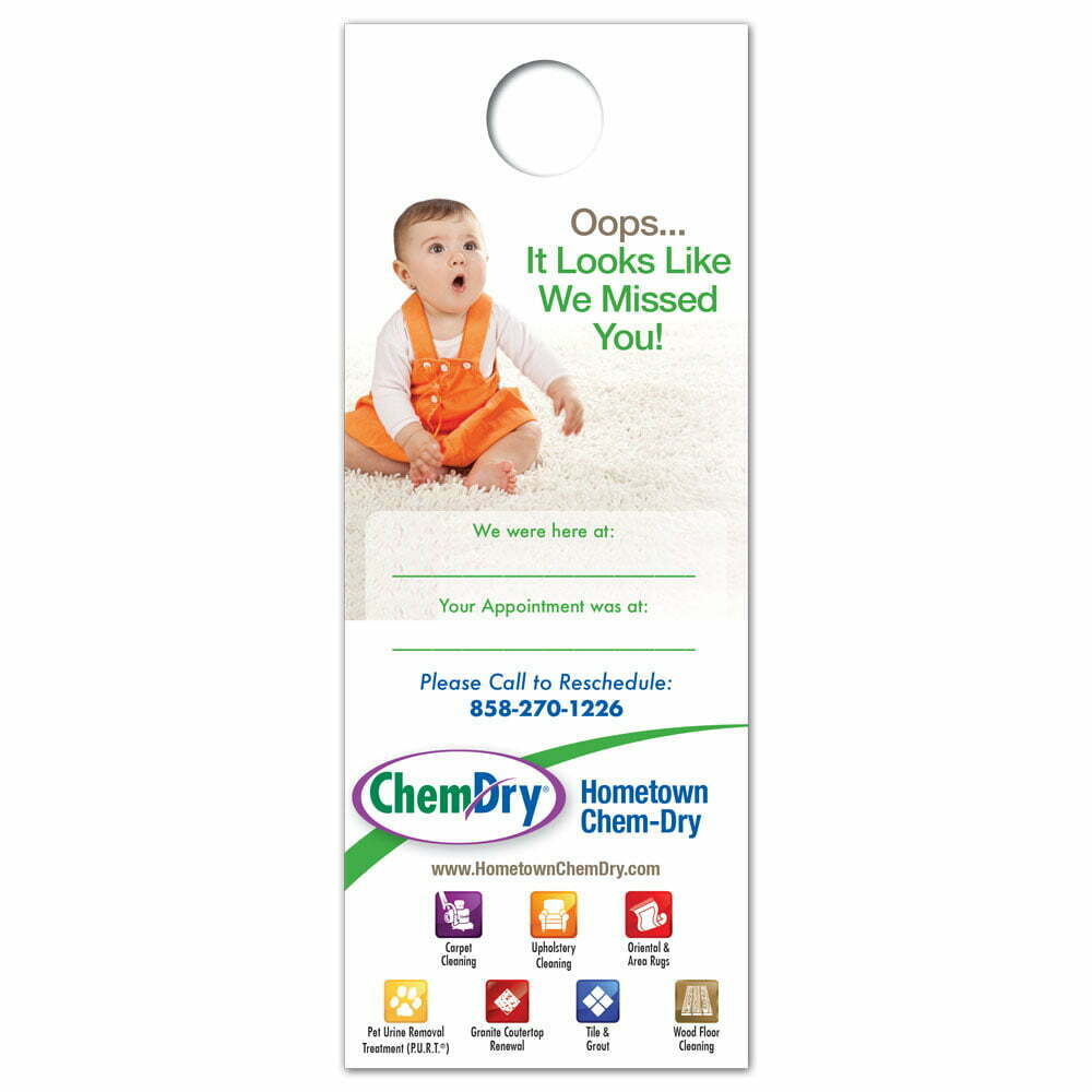 front view of a custom printed ChemDry door hanger with baby sitting on clean carpet