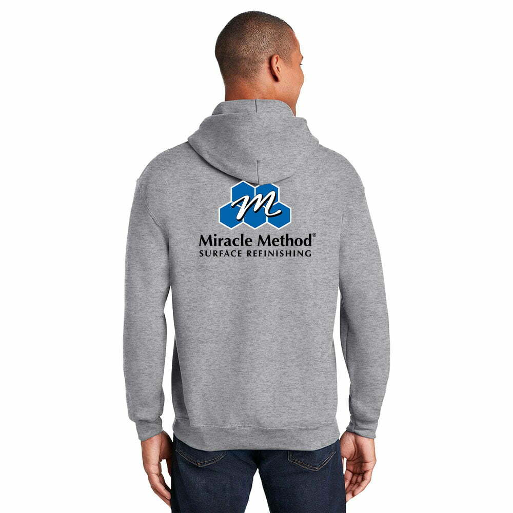 back view of shirt model wearing a grey custom printed Miracle Method long sleeve hoodie sweater